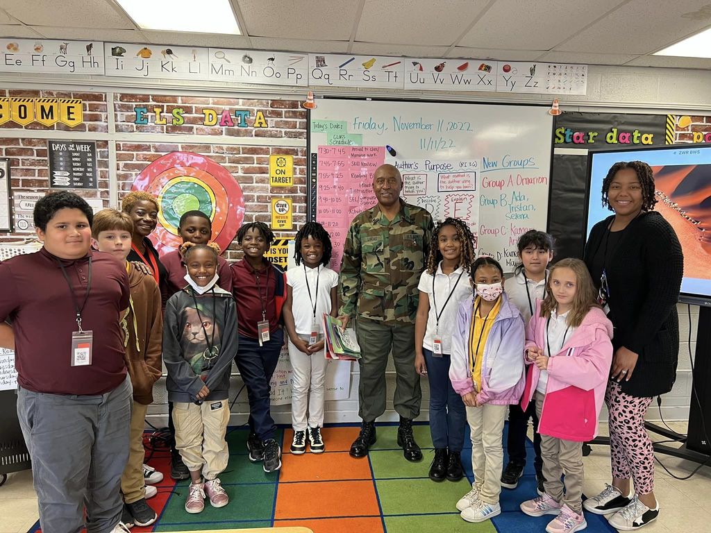 Mr. Lucas standing with students in Ms. Webb's Class.